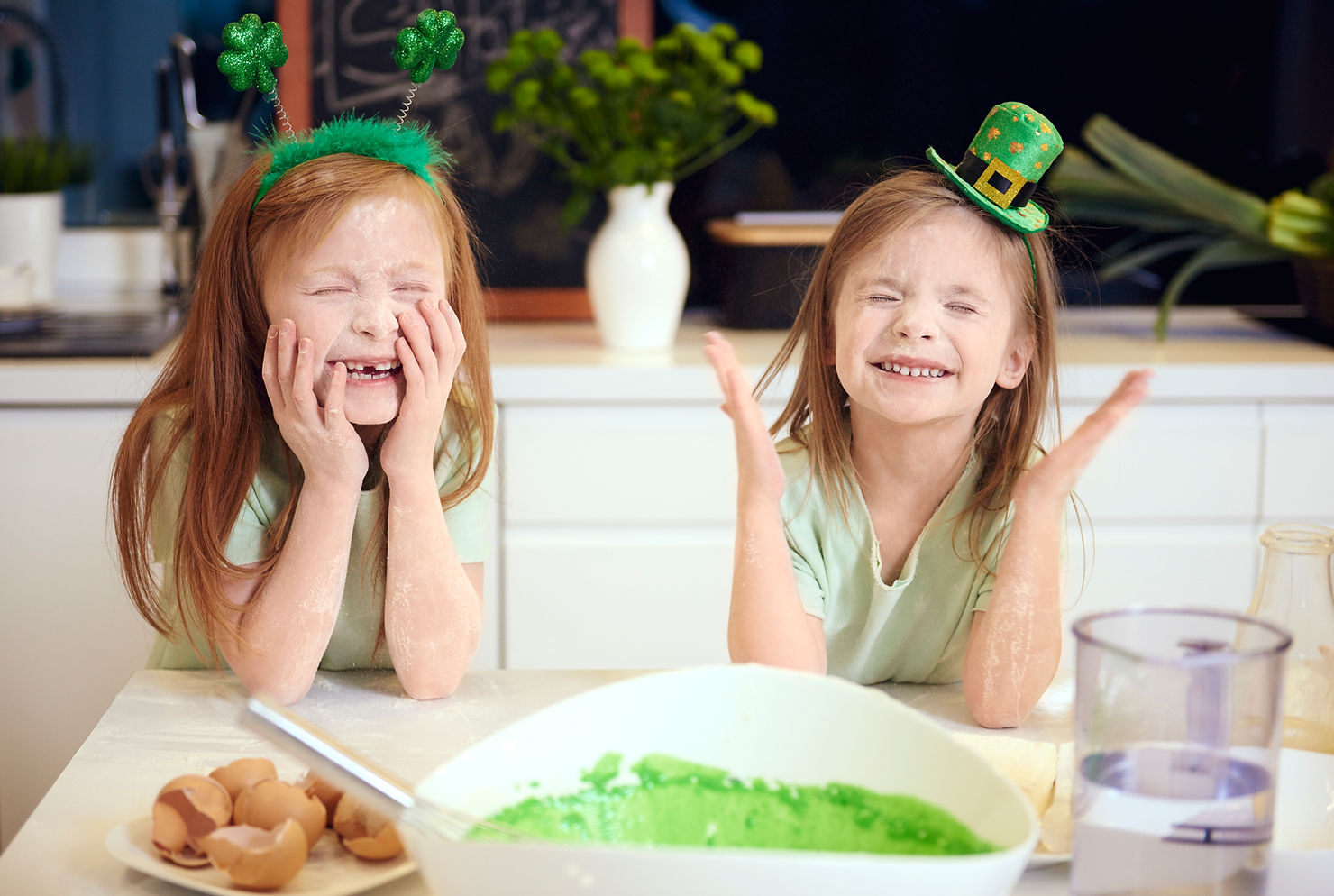 two kids celebrating st. patrick's day by making irish food