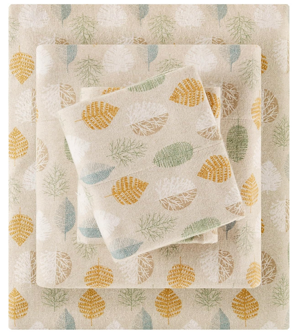 Cozy autumn decor and fall decorating ideas. Seasonal autumn decor like these flannel sheets with orange, brown, green and blue fall color leaf pattern.