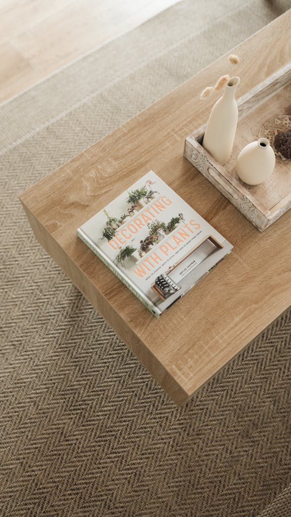 Elegant coffee table with a modern decor and a book about plant decorations.