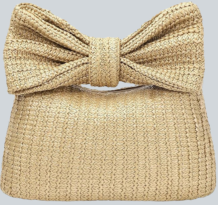woven straw clutch handbag with a bow on top