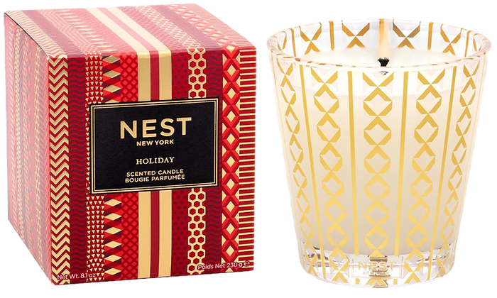 nest white and gold holiday candle in red packaging