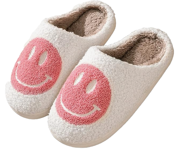 white fluffy slippers with a pink smiley face