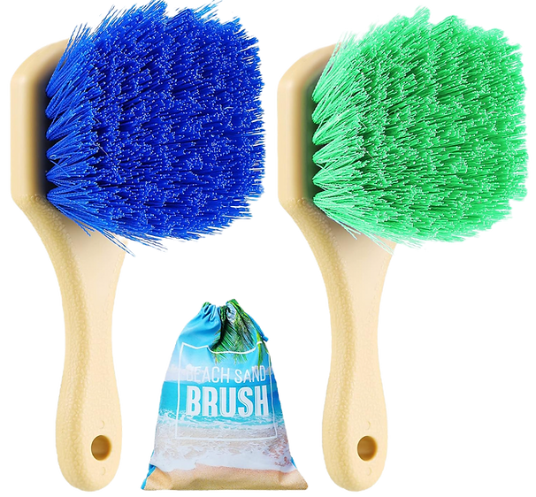 two sand brushes to be used at hte beach