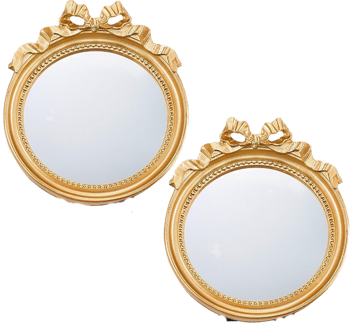 Set of two small round antique vintage looking wall mirrors with gold edging and pretty bows at the top