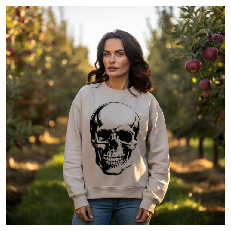 Skull Sweatshirt on a lady standing in an apple orchard on a fall day