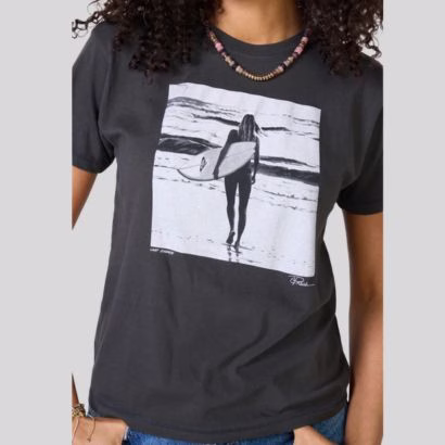 black graphic tee with woman holding surf board