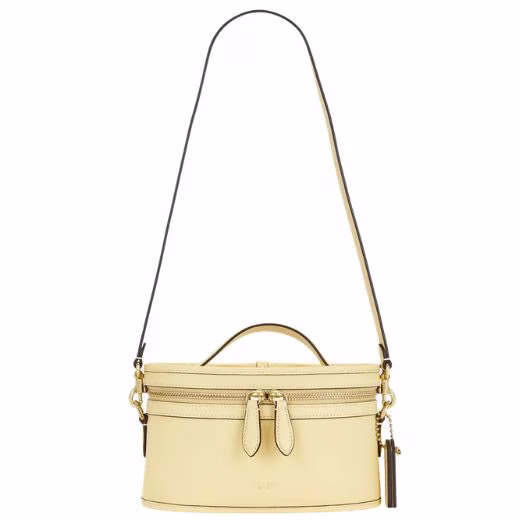 butter yellow rounded top handle crossbody bag by Coach