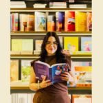 woman reading new book in bookstore