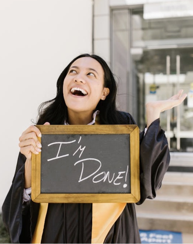 College Grad Holding a Sign Saying I'm Done