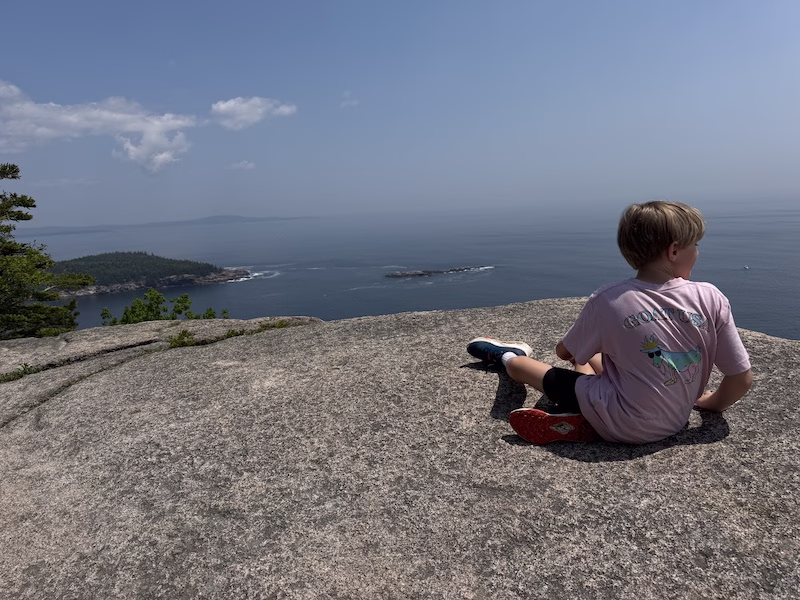 Finn at the top of Gorhman trail in acadia national park