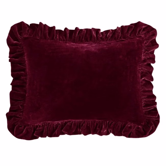 burgundy velvet pillow with a ruffle
