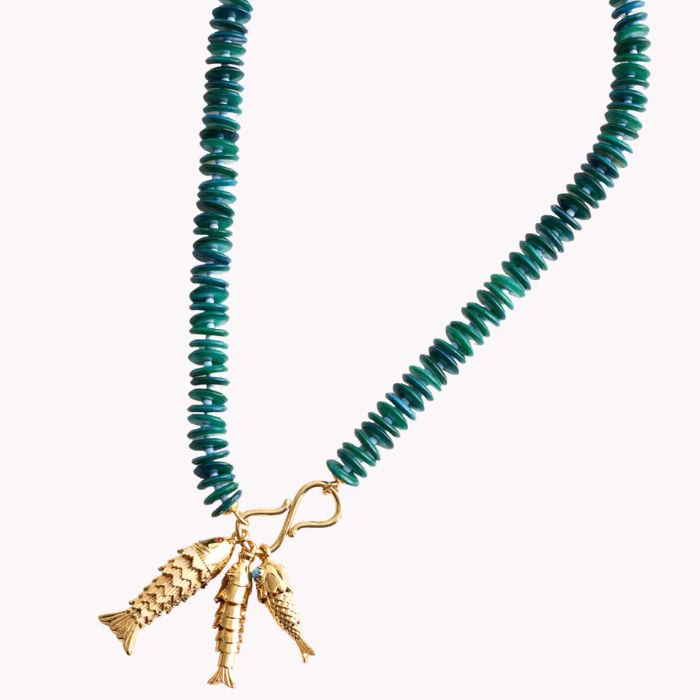 green beaded necklace with gold fish charm