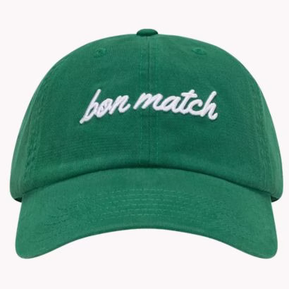 green canvas baseball hat that says bon match