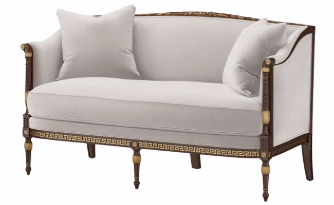 white flat back love seat with two accent pillows
