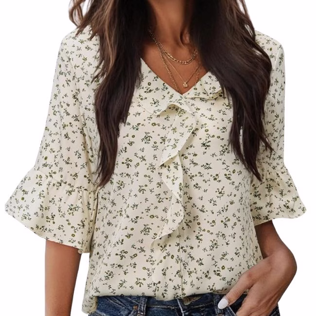 white frilly romantic blouse with green detail