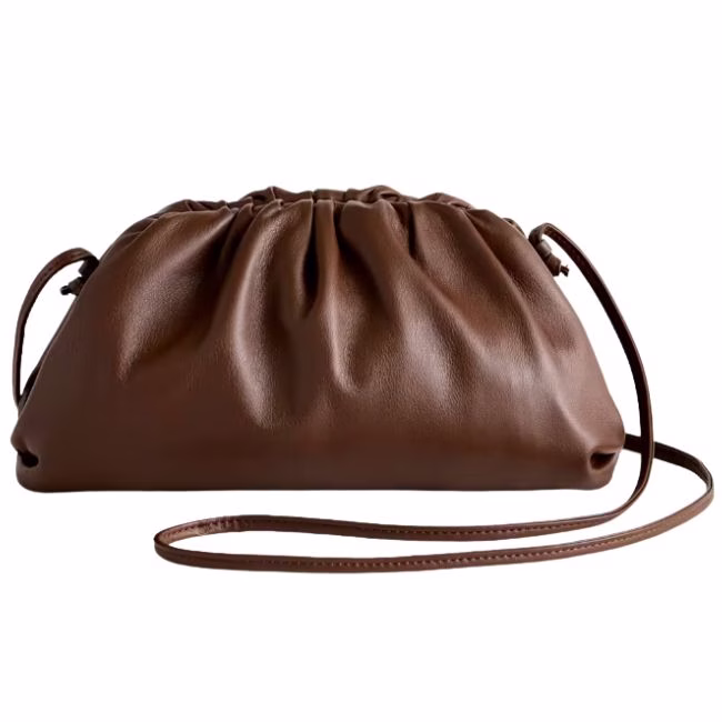 Brown leather crossbody bag with a pleated top and thin strap