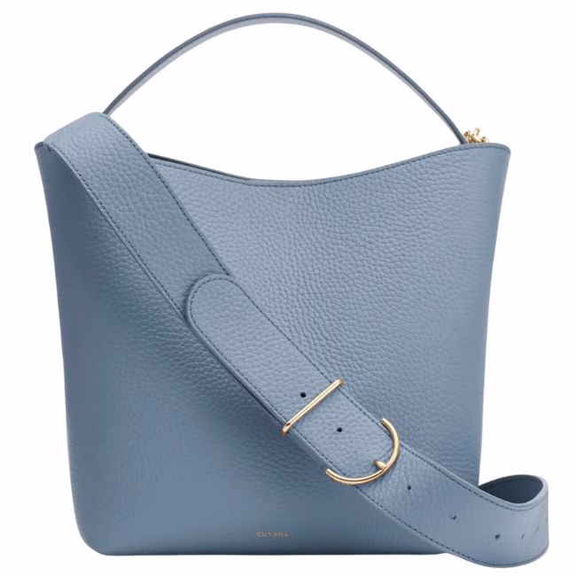 baby blue bucket bag with a top handle and long strap crossbody bag