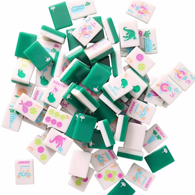 brightly colored mahjong tiles with green backs