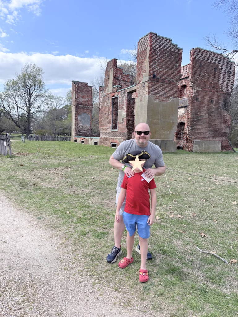 Jamestown standing in front of ruins