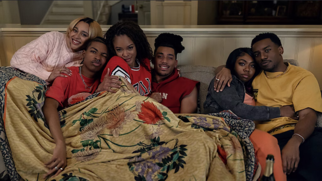 A different world cast sitting on a couch