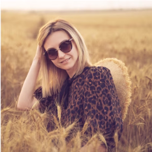woman in field wearing leopard print
