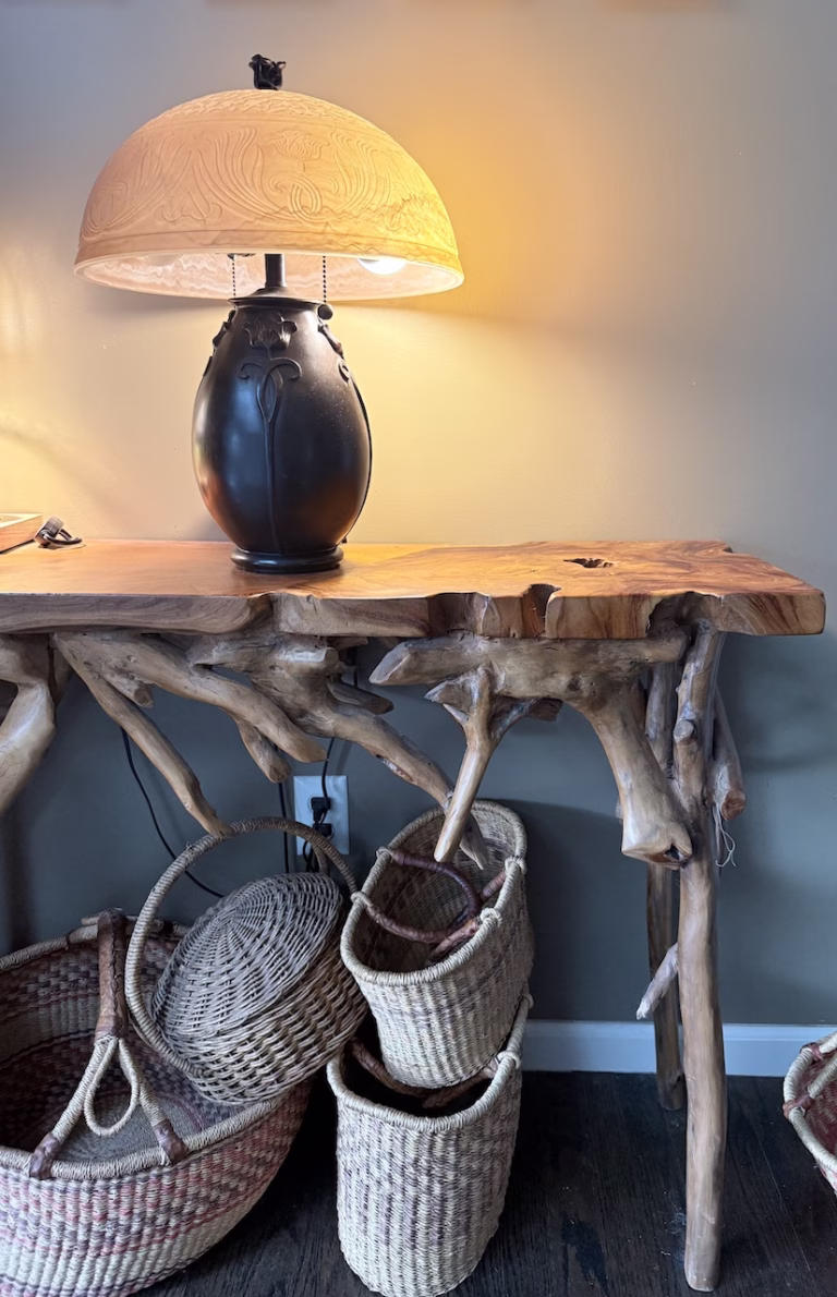 Table Lamp on a wood table with baskets underneath