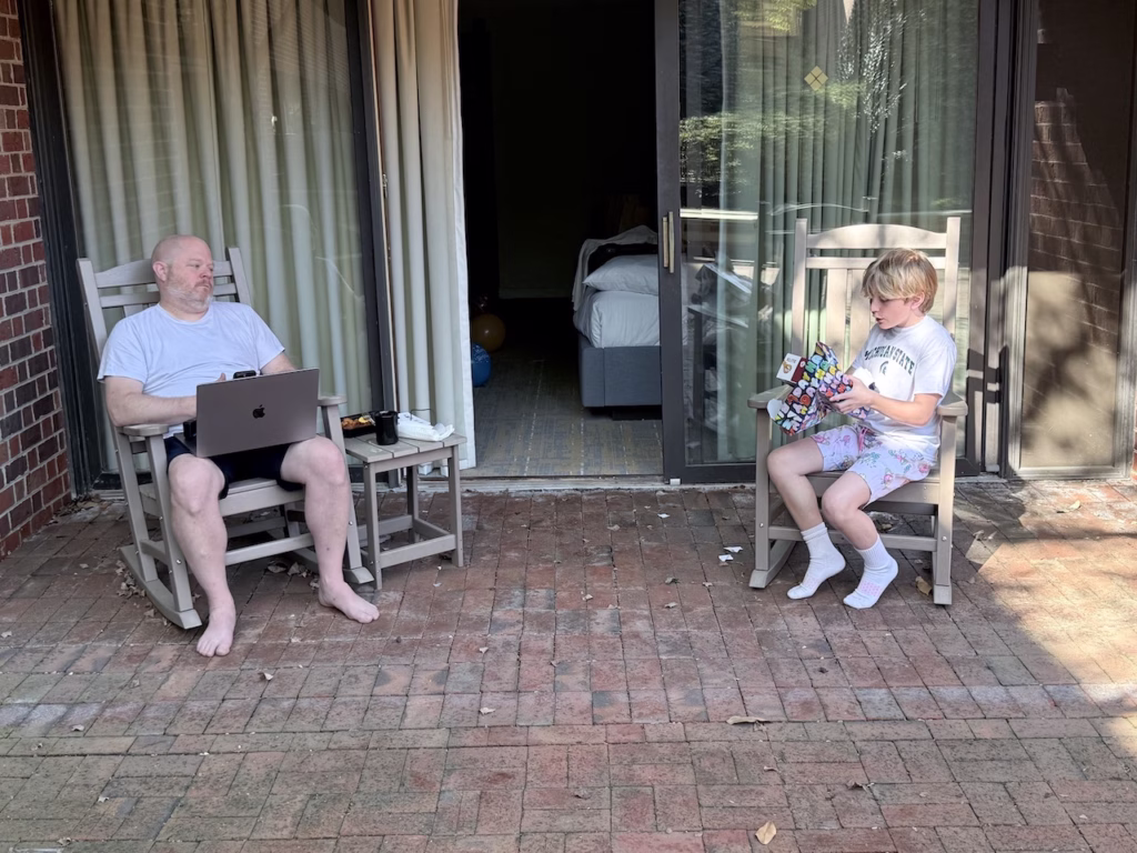 opening birthday presents on a hotel patio