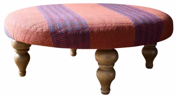 round oversized ottoman with pink and purple plaid stripes