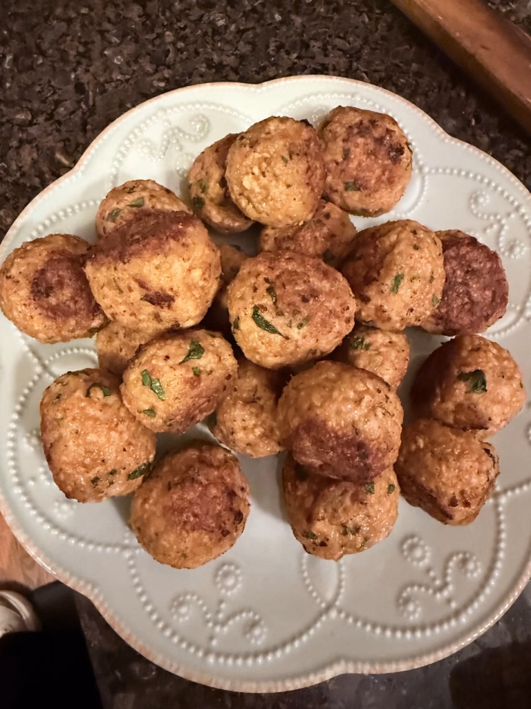 butter chicken meatballs on a plate