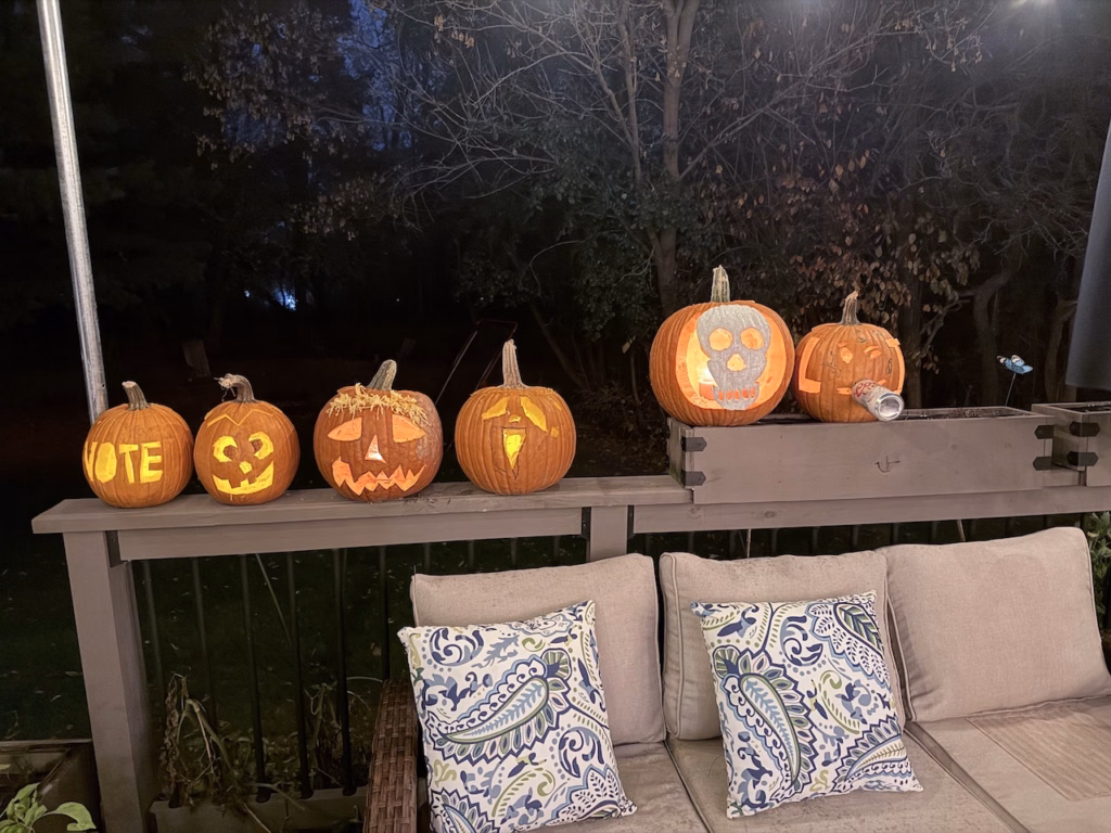carved pumpkins with a backyard