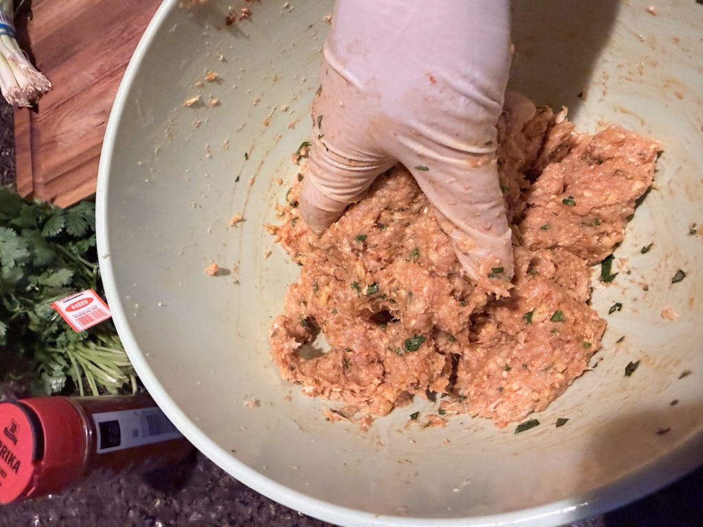 mixing ground chicken for butter chicken meatballs