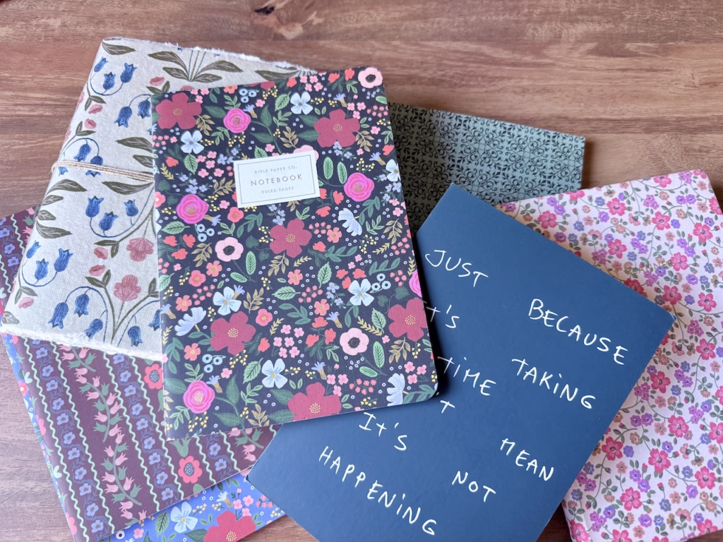 various notebooks on a table
