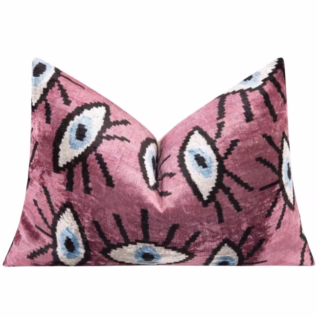 pink velvet pillow with evil eyes
